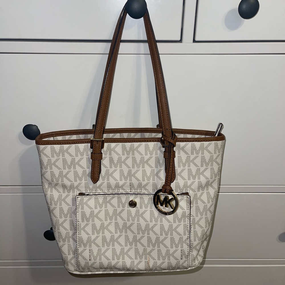 Michael kors white purse. MKs all around